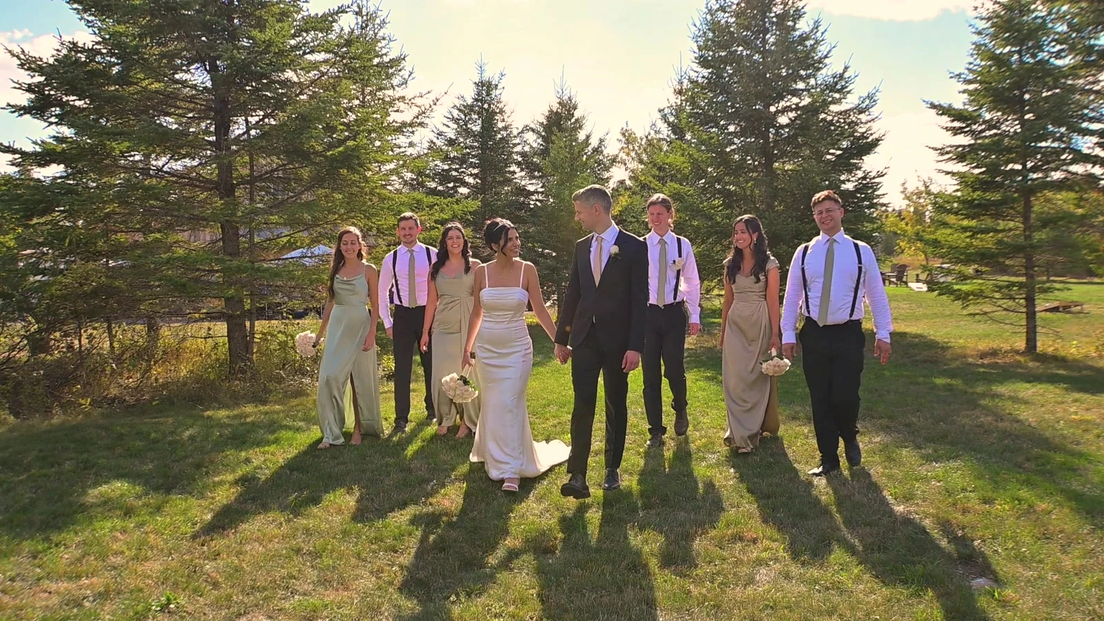 The wedding party walking together outdoors